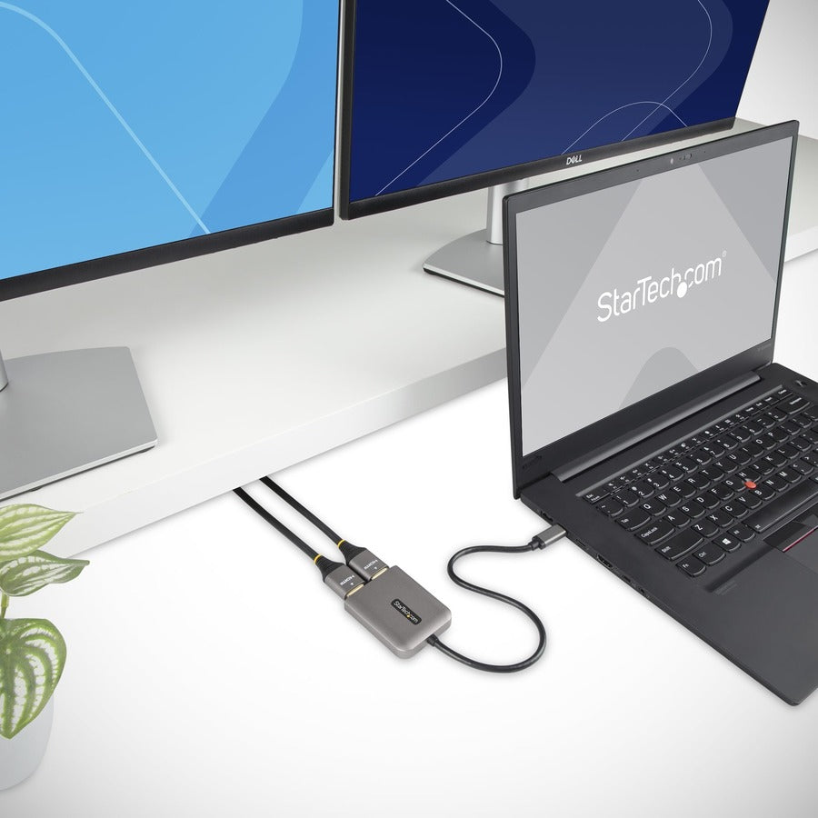 A StarTech.com USB-C to Dual HDMI Adapter with a gray body and a long black cable ending in two HDMI connectors.
